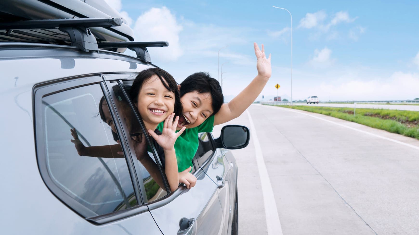 A Family Happily Driving Down the Highway