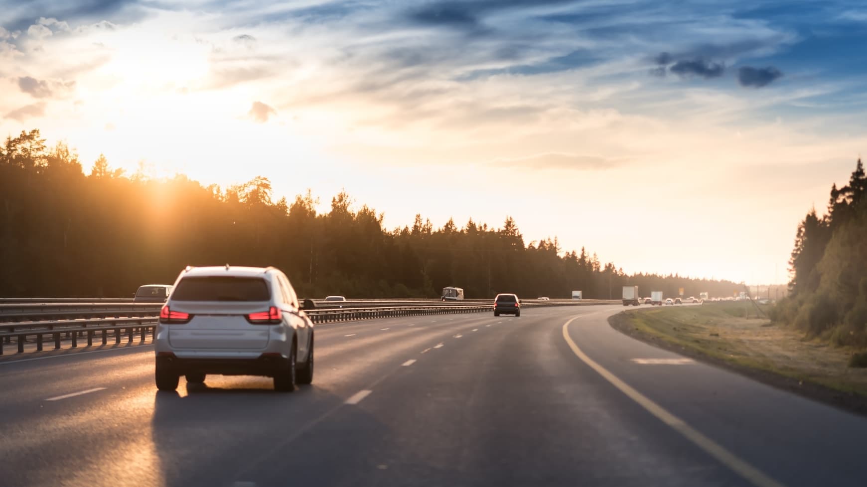 A Car on a Highway Driving into the Distance